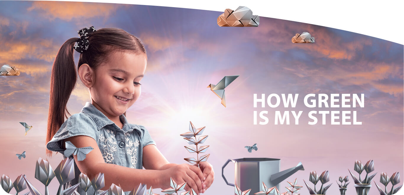 Girl holding an origami plant in Tata Steel 'How Green Is My Steel' scene