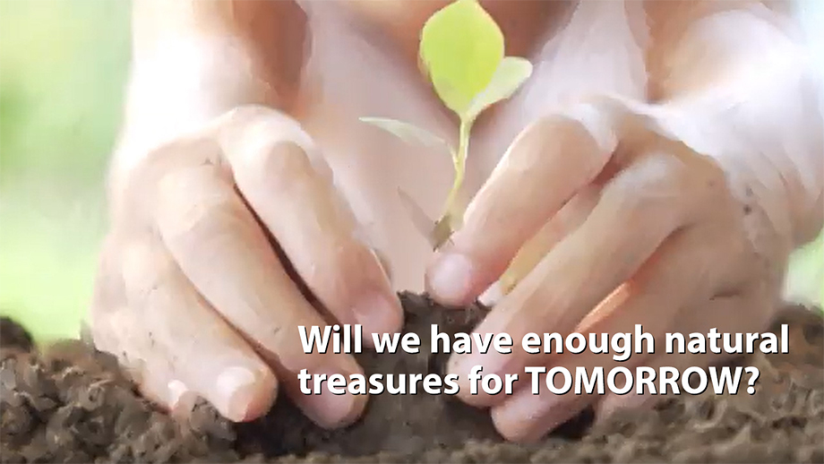 Child's hands planting a sapling in Tata Steel biodiversity film