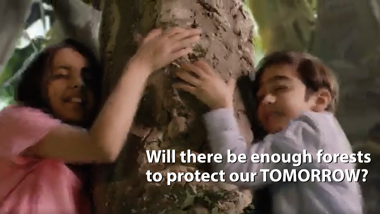 Two children hugging a tree in Tata Steel forests film
